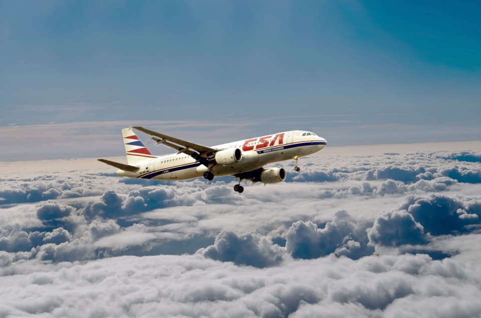 An aircraft is flying over above the clouds.